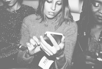 Diverse women in a backseat of a cab