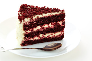 spoon cutting a red dessert