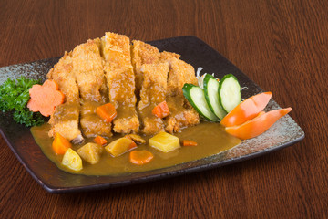 japanese cuisine. fried chicken curry on the background
