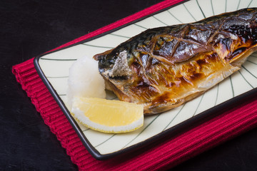 japanese cuisine. fried fish on the background