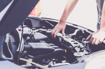 Check the condition of the car engine, repair or maintenance concept. Professional car mechanic...