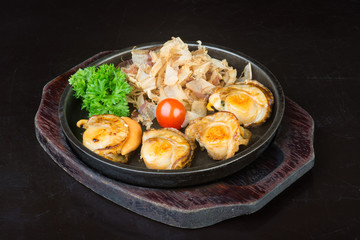 japanese cuisine. grilled shell fish on the background