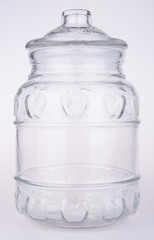Glass bottle or candy jar on a background.