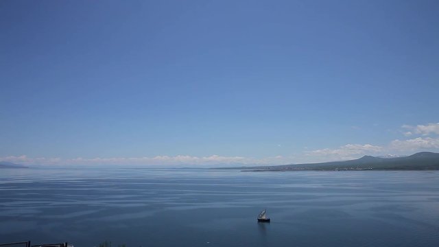 Sailboat floats in the sea or ocean, an old style ship on the water