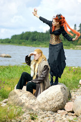red-haired woman and a man on the beach. Fabulous image.