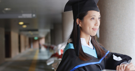 Woman wearing graduation gown