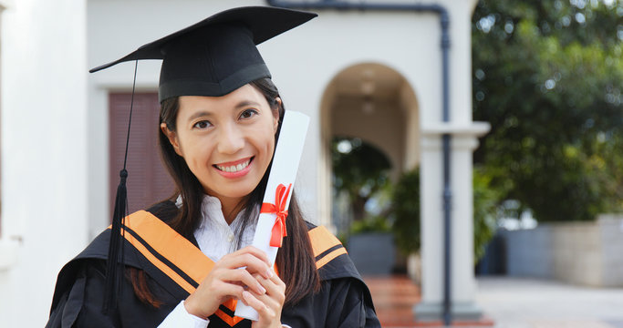 Excited woman get graduation in university campus