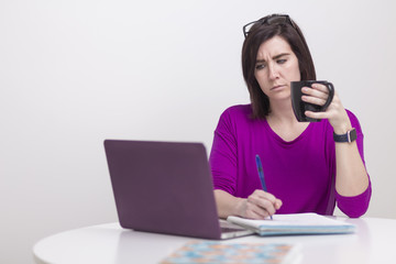woman in Zoom meeting on laptop working from home
