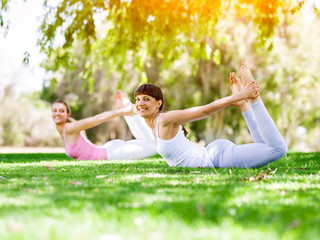 Young women exercising in the park