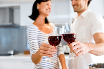 Portrait of a couple having a glass of red wine