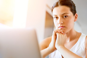 Young beautiful woman working on her laptop