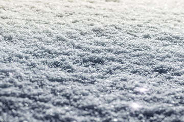 Fototapeta premium Part of the surface of fresh snow on the hood of the car.