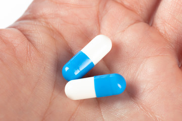 pills in woman hand