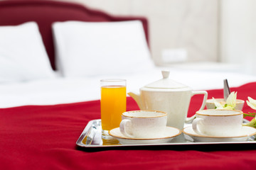 Breakfast in bed in hotel room
