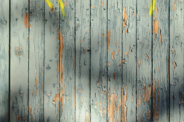 Background texture from the battered old boards with falling off paint blue green