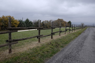 Fototapeta na wymiar wooden fence along the road