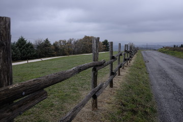 Fototapeta na wymiar wooden fence along the road