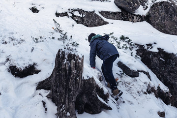 Boy playing with snowballs
