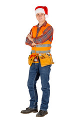 Full length portrait of a male builder in a santa hat  over white wall background. repair, construction, building, people and maintenance concept.