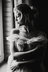 Woman standing in front of the window