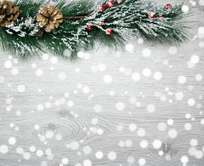 Christmas and New Year's composition. The pine cones, spruce branches on a wooden white background