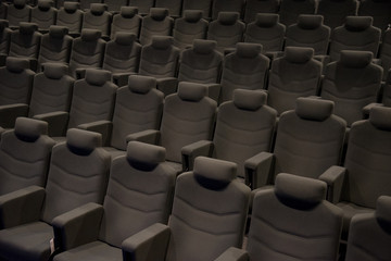 Naklejka premium Cinema hall with beige armchairs
