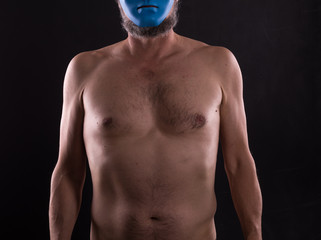 naked man in blue mask
