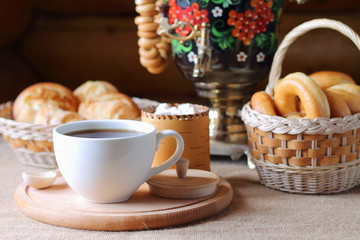 Russian tea from a samovar and pastries in a basket.