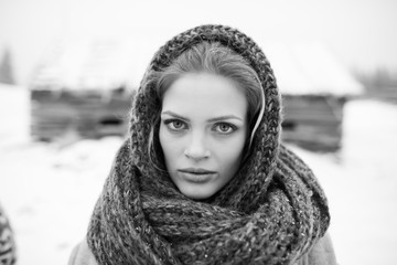 Young and sexy blond girl wearing blue scarf in winter