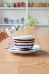 Coffee on a wooden table in a coffee shop