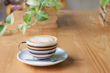 Coffee on a wooden table in a coffee shop