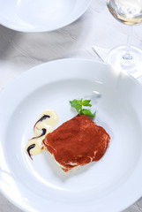 homemade tiramisu dessert and basil