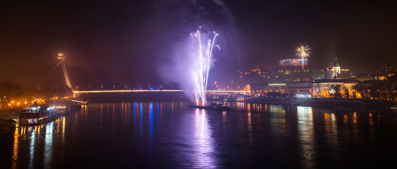 Fototapeta na wymiar New Year Celebration. Fireworks on Danube River in Bratisalva, Slovakia