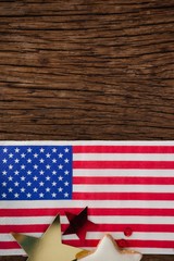 American flag and star shape decoration arranged on wooden table