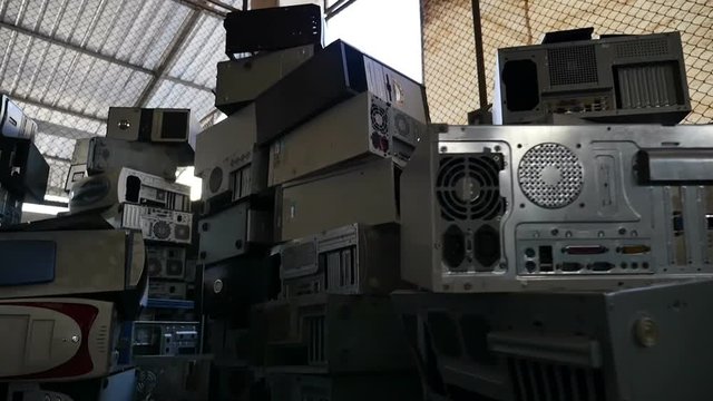 Dolly shot of electronic parts for recycling 