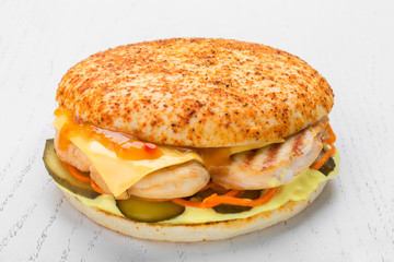 chicken burger with chicken grill, pickle, cheese, carrot