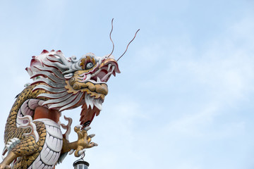 Arts of Chinese temple with dragon on blue sky background