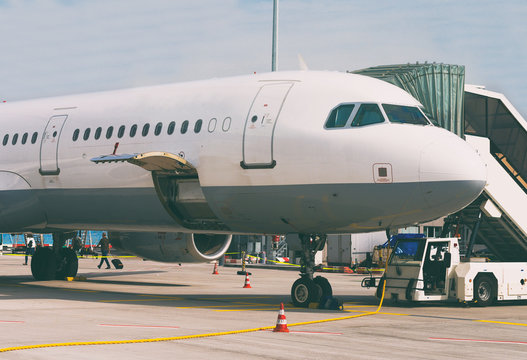 Passenger plane in the airport. Unboarding.