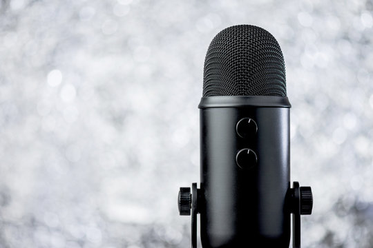 
Black Profesional Microphone On Blurred Background With Bokeh