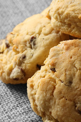 Homemade fruit scones on a hessian background