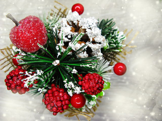 Fototapeta na wymiar christmas decoration winter berries and snow on wooden background
