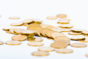 Columns of gold coins, piles of coins on white background