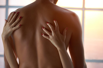 Hands of woman, shirtless man. Passionate foreplay close up.