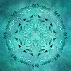 Ethnic floral mandala on grunge background.