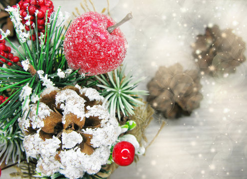 christmas decoration winter berries and snow on wooden background