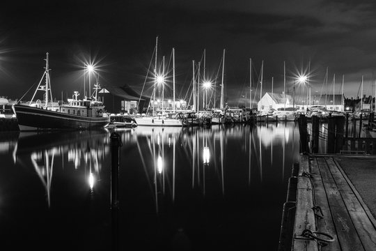 Boats in marina in black and white