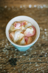 Coffee with marshmallow in a light blue cup