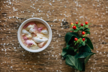 Coffee with marshmallow in a light blue cup