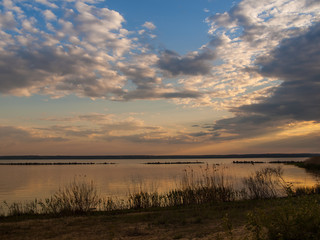 Picturesque view of the river at sunset with cloudy sky