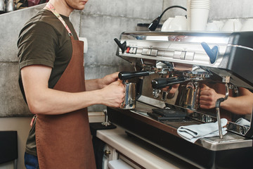Barista. Hand making the coffee closeup